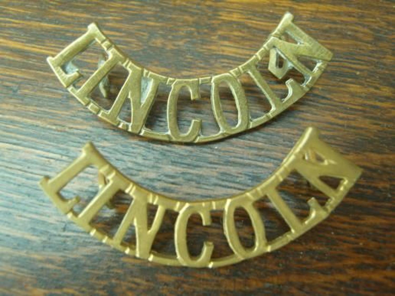 Pair of WW1 Brass shoulder titles. Lincolnshire Regiment
