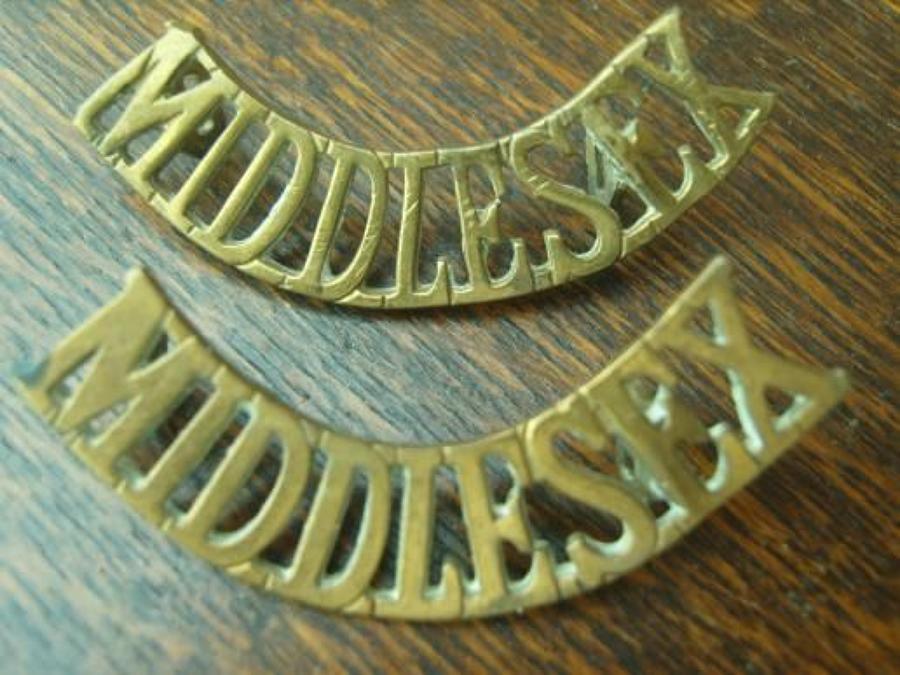 Pair of WW1 Brass shoulder titles. Middlesex Regiment