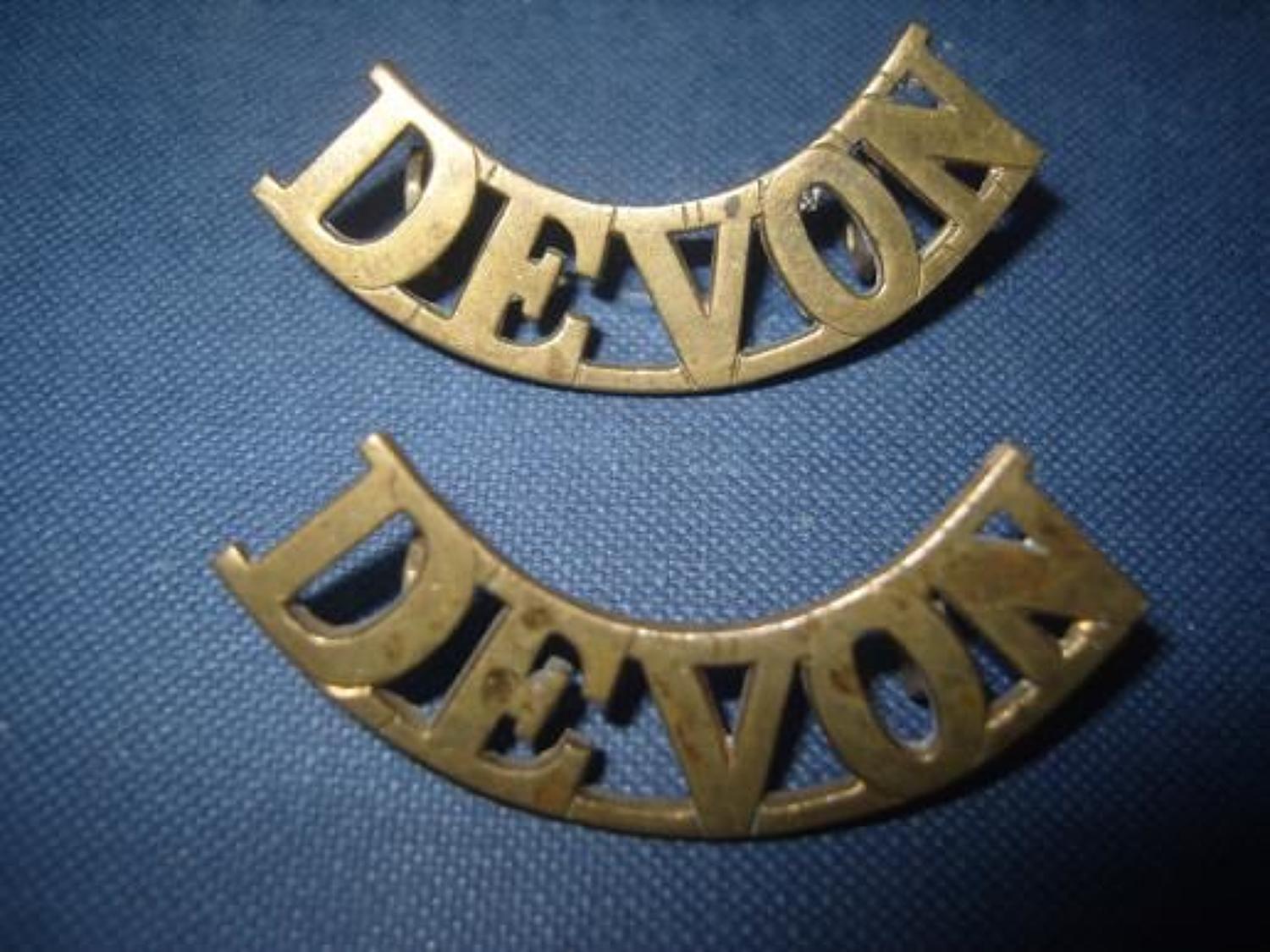 Pair of WW1 Brass shoulder titles. Devonshire Regiment