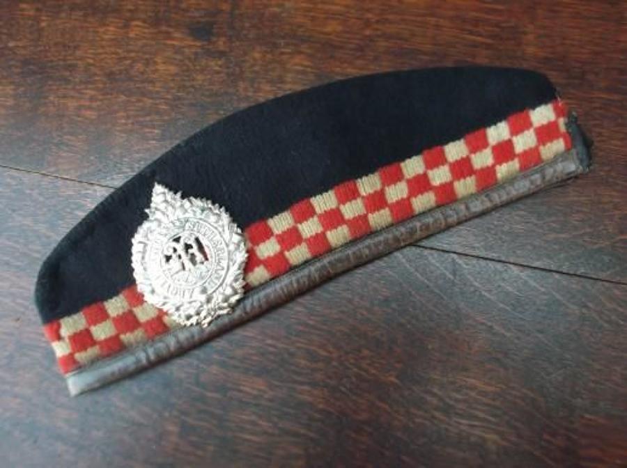 Original WW1 Highland Glengarry with leather trim. Silk tails cut off (Common practice for front line troops) . Original Argylls o/r's badge .Red tourie (pom pom)