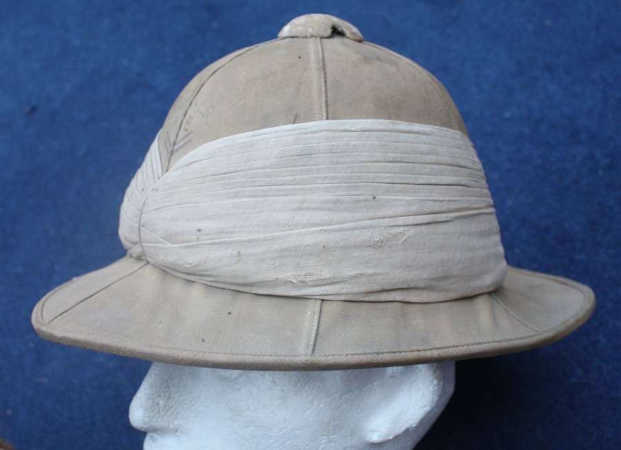 WW1 pattern British khaki named Pith Tropical Sun helmet.