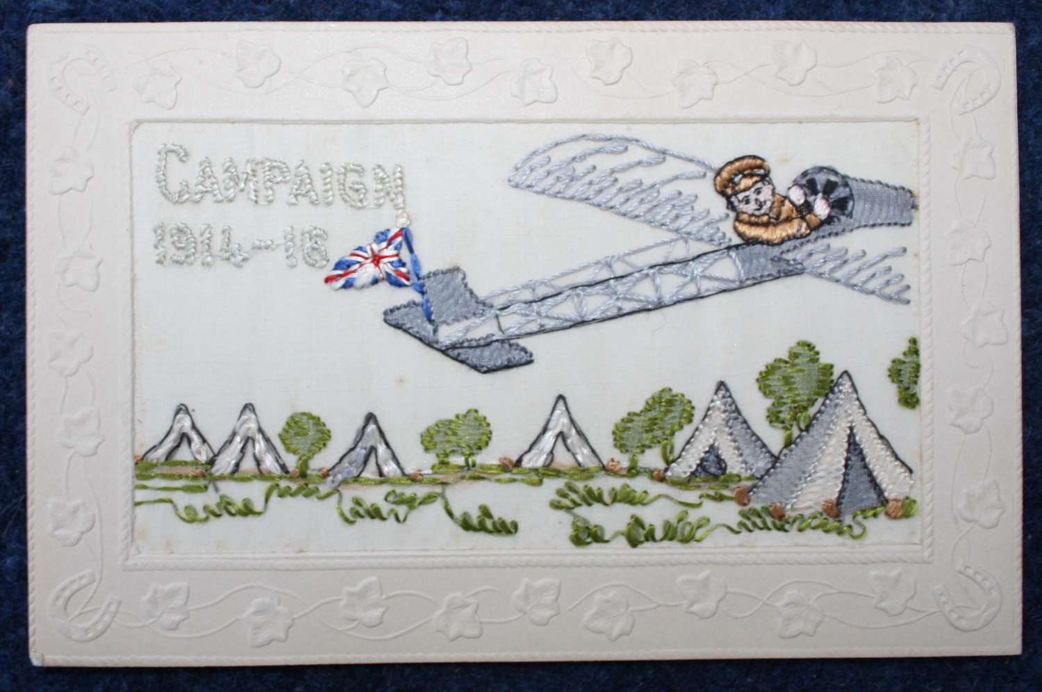 WW1 Embroidered Silk Postcard. British Soldier Flying an Aeroplane.
