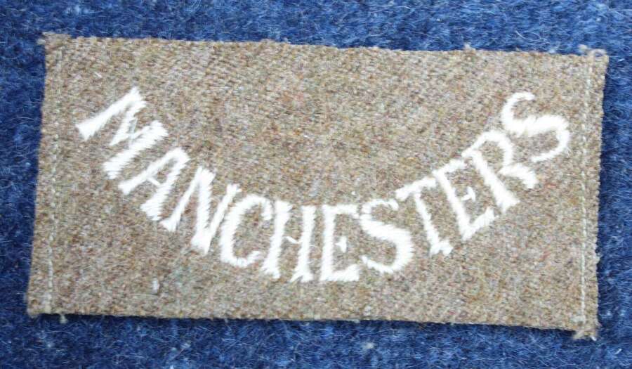 Very rare WW1 British Army Manchester Regiment Khaki shoulder badge